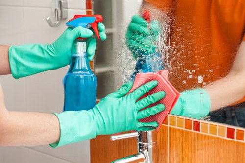 Cleaner placing warning sign on a freshly mopped floor