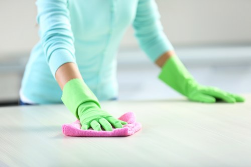Technician cleaning a stair carpet in Brent using steam extraction equipment