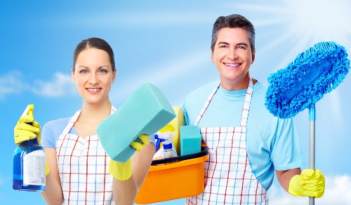Experienced cleaners working around office furniture in Brent
