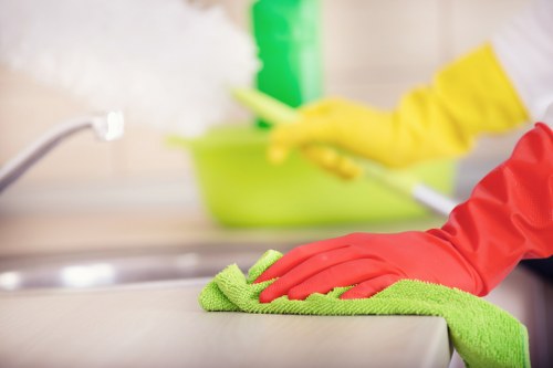 Local window cleaner working on hard-to-reach windows in Brent